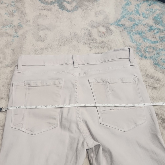 Frame grey denim pants small hole on right back pocket pointed out. Runs small - Picture 3 of 4